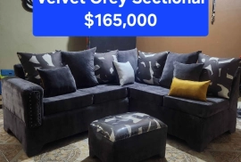 Brand New Velvet Grey Sectional With Ottoman. Cushions